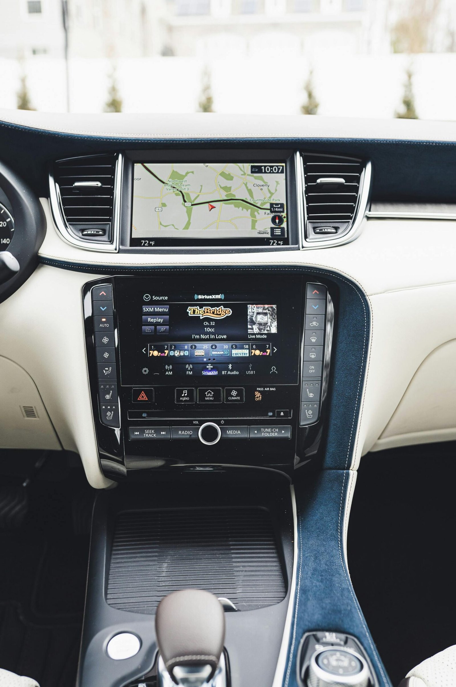 Luxurious car interior featuring advanced dashboard controls and navigation system for technology enthusiasts.